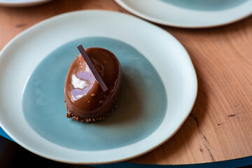 Delicious dessert in a blue plate in a cafe