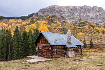 Gothic Cabin - Rustic log cabin with a tin roof on the edge of town in Gothic Colorado in Gunnison County in Autumn