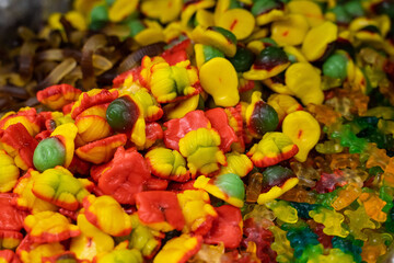 Assortment of colorful delicious marmalade jelly candies for sale on counter of shop, grocery, market, cafe. Dessert, sweet food and confectionery concept