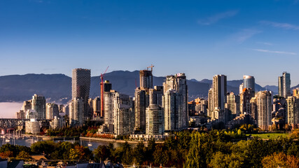 Obraz premium Skyline of Downtown Vancouver, British Columbia, Canada at Sunset. Viewed from the South Shore of Falls Creek