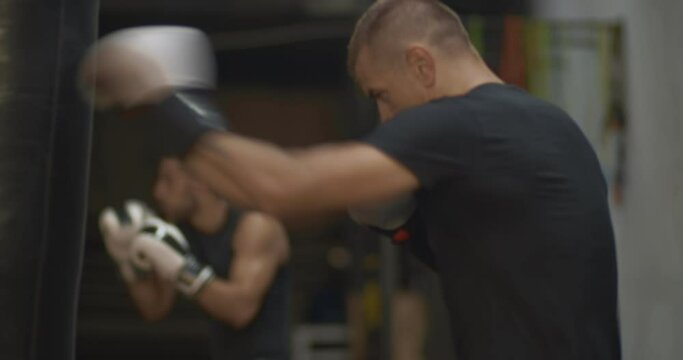 Kick box exercises in an inside garage