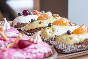 three eclairs with custard in a bakery