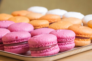 Multi-colored delicious macronies in the bakery