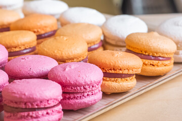 Multi-colored delicious macronies in the bakery