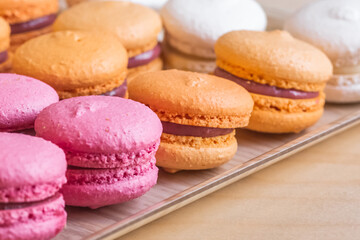 Obraz na płótnie Canvas Multi-colored delicious macronies in the bakery
