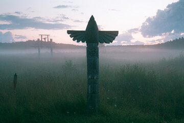 View of the field with an ancient totem at dusk, Northern Russia..