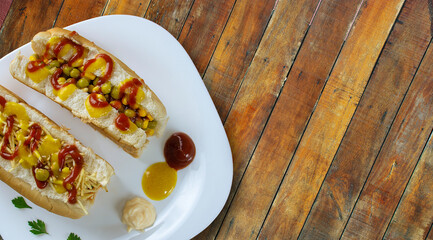 Hot dog with yellow mustard, ketchup, peas and corn