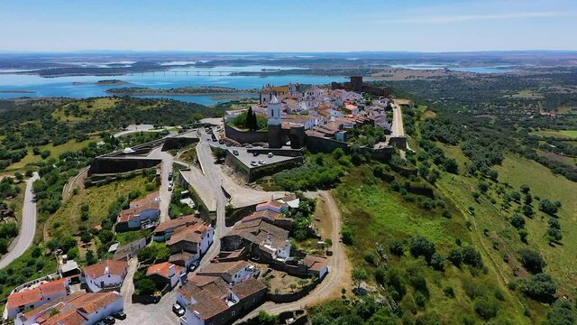 Aerial view of the Monsaraz Castle on a hill overlooking countryside, Portugal.