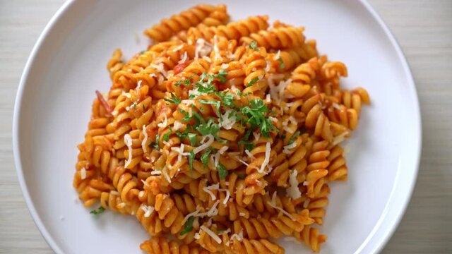 spiral or spirali pasta with tomato sauce and cheese - Italian food style