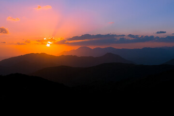 mountain sunset with dramatic clouds