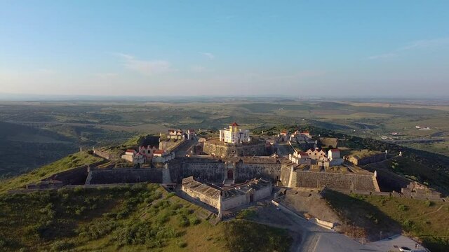 Aerial view of fortified village on hill in Portugal.