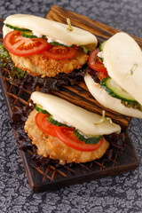 Steamed wheat bun dressed with designer sauce. Vietnamese cuisine concept. Still life. Close-up.