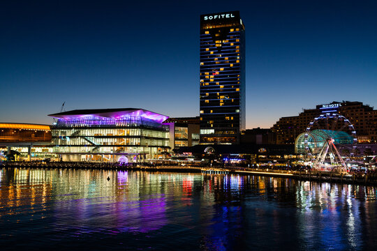 Night view of Darling Harbour with Sofitel hotel and the International Convention Centre in Sydney NSW Australia