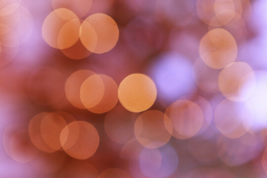 Colorful bright red and orange lights are blurred. boce as background. new year's lights