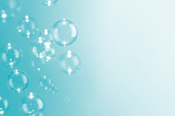 Beautiful shiny soap bubbles float on soft green background with copy space. Abstract, Celebration, Natual fresh summer, Chrimas holiday soft white texture. 