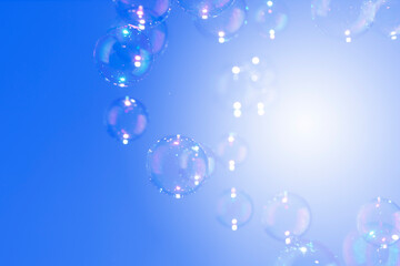 Beautiful shiny blur defocus soap bubbles float on dark blue background with copy space. Abstract, Celebration, Natual fresh summer, Chrimas holiday background.