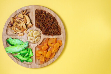 Various dried fruits. concept of the Jewish holiday Tu Bishvat. Flat lay, top view with copy space. mango, raisins, papaya, bananas, dried apricots
