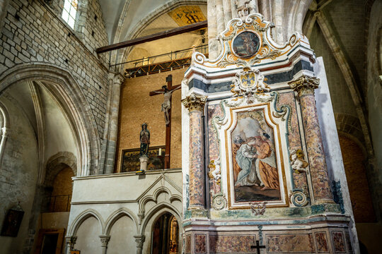 Interior view of Valere Basilica with close-up on old religious paintings in Sion Valais Switzerland
