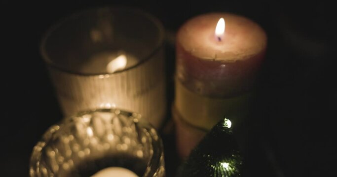 decorated christmas table with christmas cookies, nuts, gingerbread, dried fruits, cinnamon stars, cinnamon sticks and a christmas tree in background in 4k