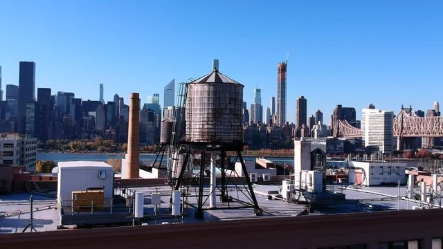 Water Tower On Rooftops Overlooking The Residential Building At Hunter's Point South In Long Island, New York City, USA. - aerial