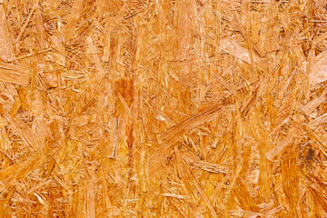 pressed wooden panel background - texture of oriented strand board - OSB wood texture.
