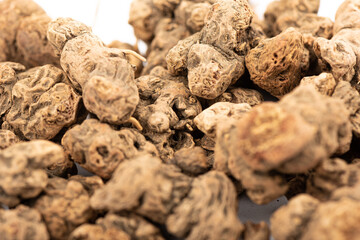 Selective focus on galangal roots. Galangal roots close-up.