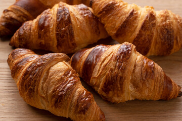 Croissants on a wooden background
