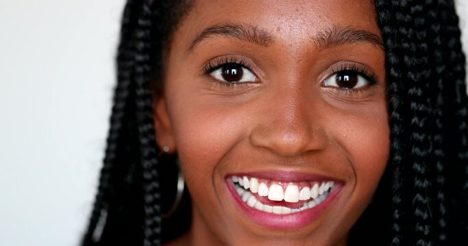 African girl surprise reaction, black teen young woman close-up face reacting with shock