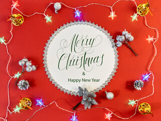 Fototapeta na wymiar Happy New Year and Merry Christmas! flat lay, with text - Merry Christmas, on a red background