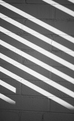 Diagonal Lines on a white brick wall