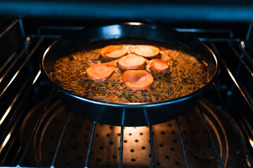 plant-based food,  vegan lentil loaf with carrots and onions cooking in the oven