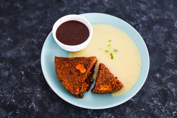 plant-based food,  vegan lentil loaf with carrots and onions served with mushroom gravy and nutritional yeast hollandaise sauce
