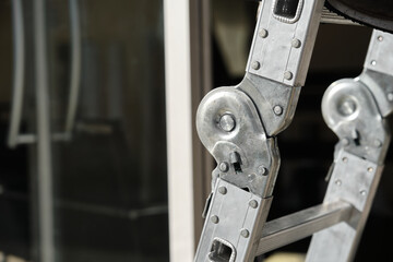 Folding ladder hinge. Aluminum folding ladder details.  © ozencdeniz