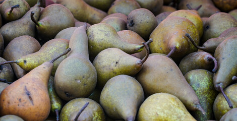 natural pears exposed on the stall to be sold and consumed by customers