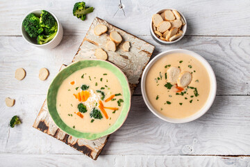 Diet detox food concept. Healthy broccoli cream soup in bowl on light background. Food recipe background. Close up