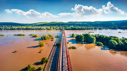Flooded valley in western Ukraine. Flood on Dniester River. View from flying drone of Nyzhniv canyon after few days of huge rain. Disaster concept background.