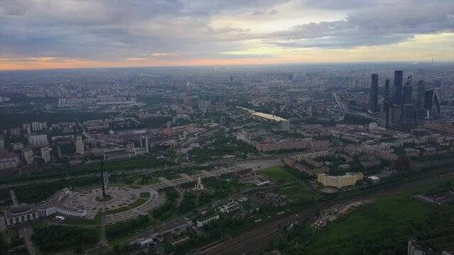 sunset sky moscow city poklonnaya hill park cityscape aerial flight over panorama 4k russia