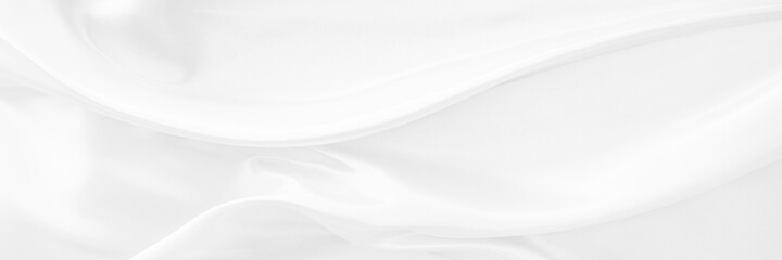 White gray satin texture that is white silver fabric silk panorama background with beautiful soft blur pattern natural.
