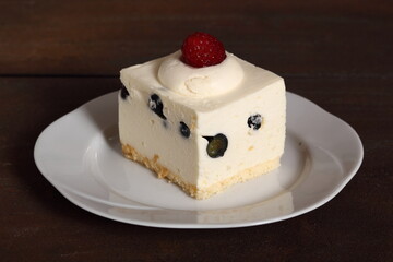 Frozen cheesecake with blueberry and raspberry