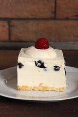 Frozen cheesecake with blueberry and raspberry