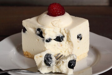Frozen cheesecake with blueberry and raspberry
