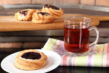 Marzipan cookies with jam and cup of tea