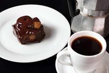 Coffee cup and single cream puff