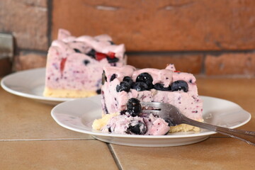 Cold cheesecake with blueberry and strawberry