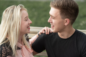 Happy couple in love looking at each other and having fun