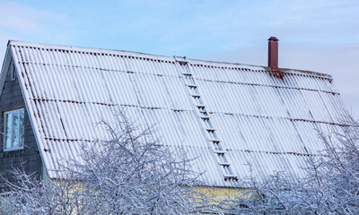 Fototapeta premium Snow on the roof of the house.