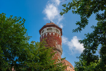 Water old tower of Svetlogorsk, Kaliningrad region, Russia against a blue sky with clouds