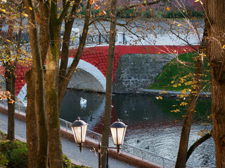 pond with birds and a bridge in autumn. Gomel, Belarus