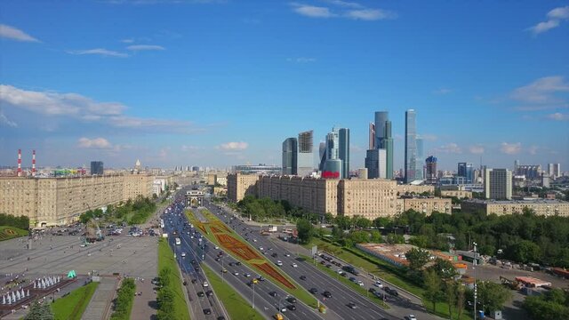 sunny moscow city famous kutuzovsky prospect traffic street aerial flight over panorama 4k russia