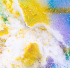 Yellow and blue paint on the snow in winter.